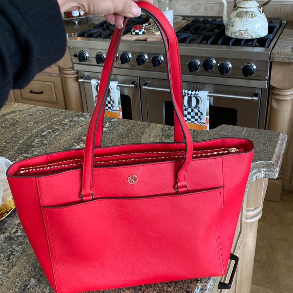 Tory Burch great red tote, lots of great pockets and middle zipped pocket.